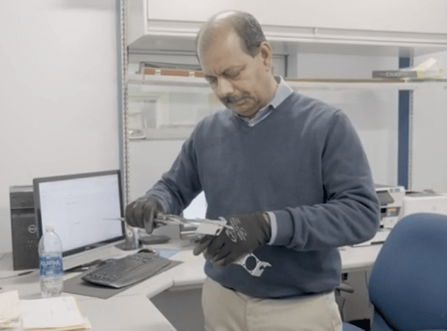 a Garwood employee working with metal