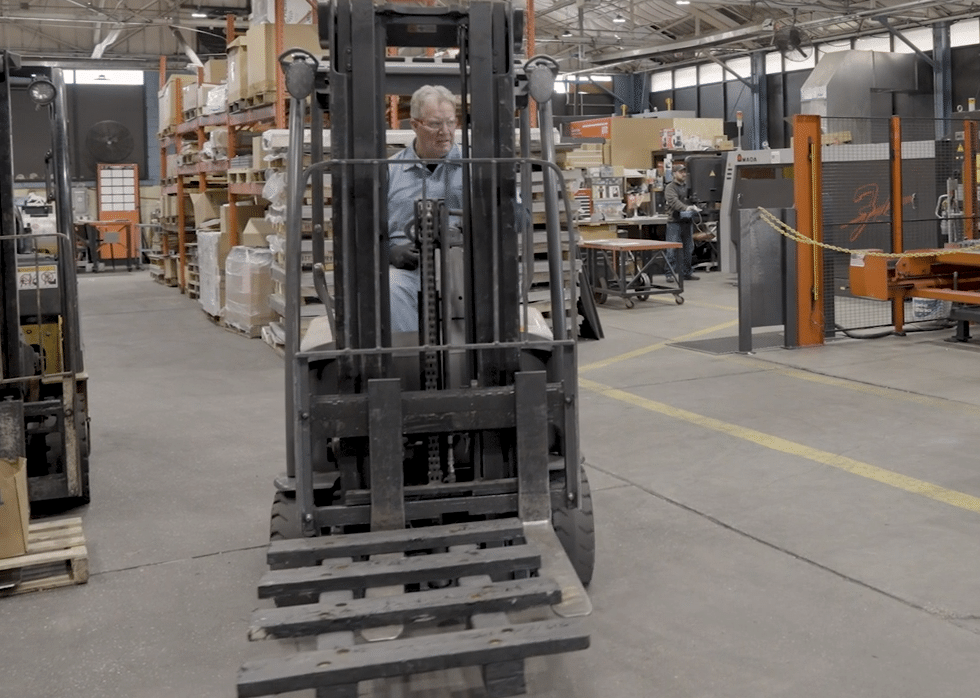a Garwood employee operating a forklift